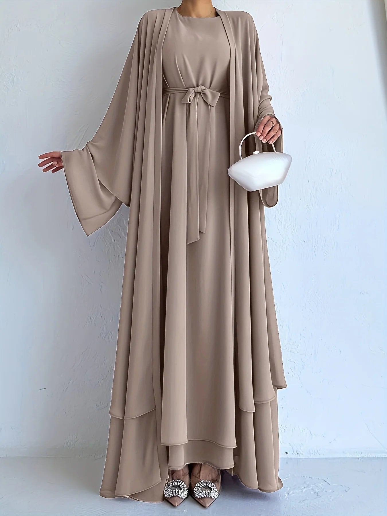 Muslim robe, a two-piece outfit consisting of a vest and a wrap dress, includes a belt.