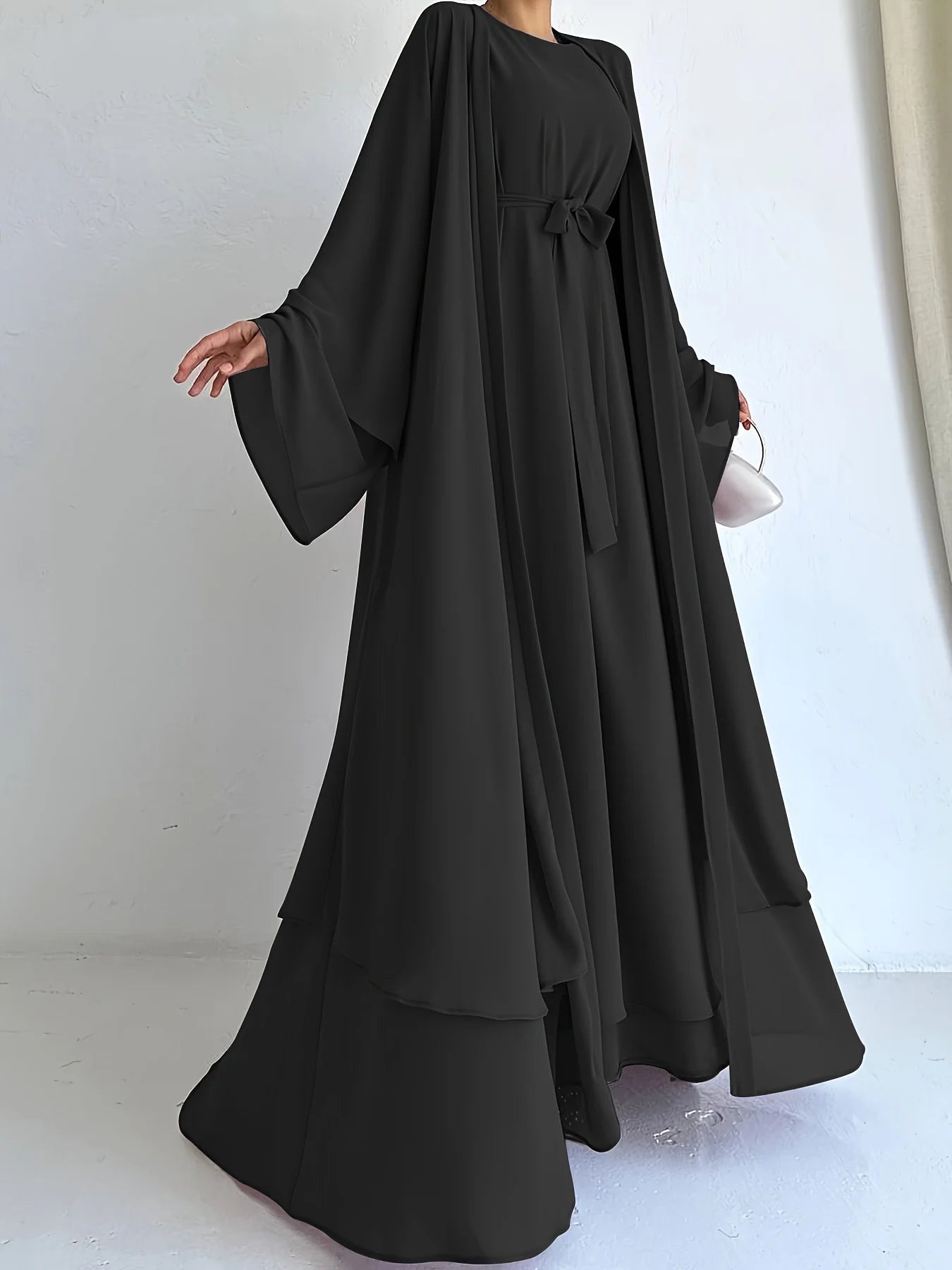 Muslim robe, a two-piece outfit consisting of a vest and a wrap dress, includes a belt.
