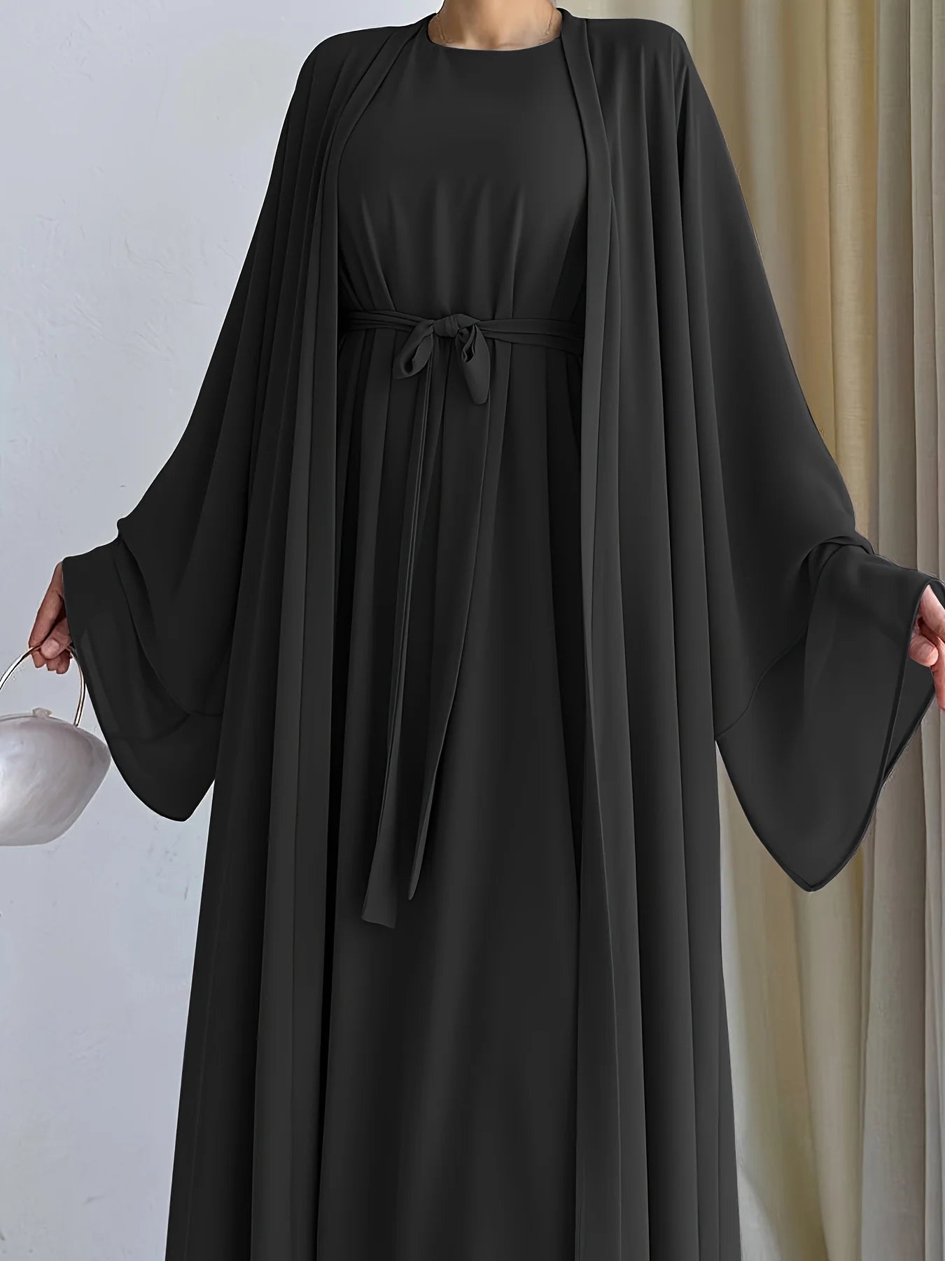 Muslim robe, a two-piece outfit consisting of a vest and a wrap dress, includes a belt.