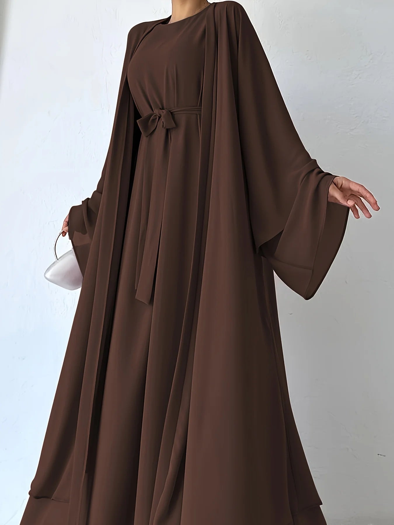 Muslim robe, a two-piece outfit consisting of a vest and a wrap dress, includes a belt.