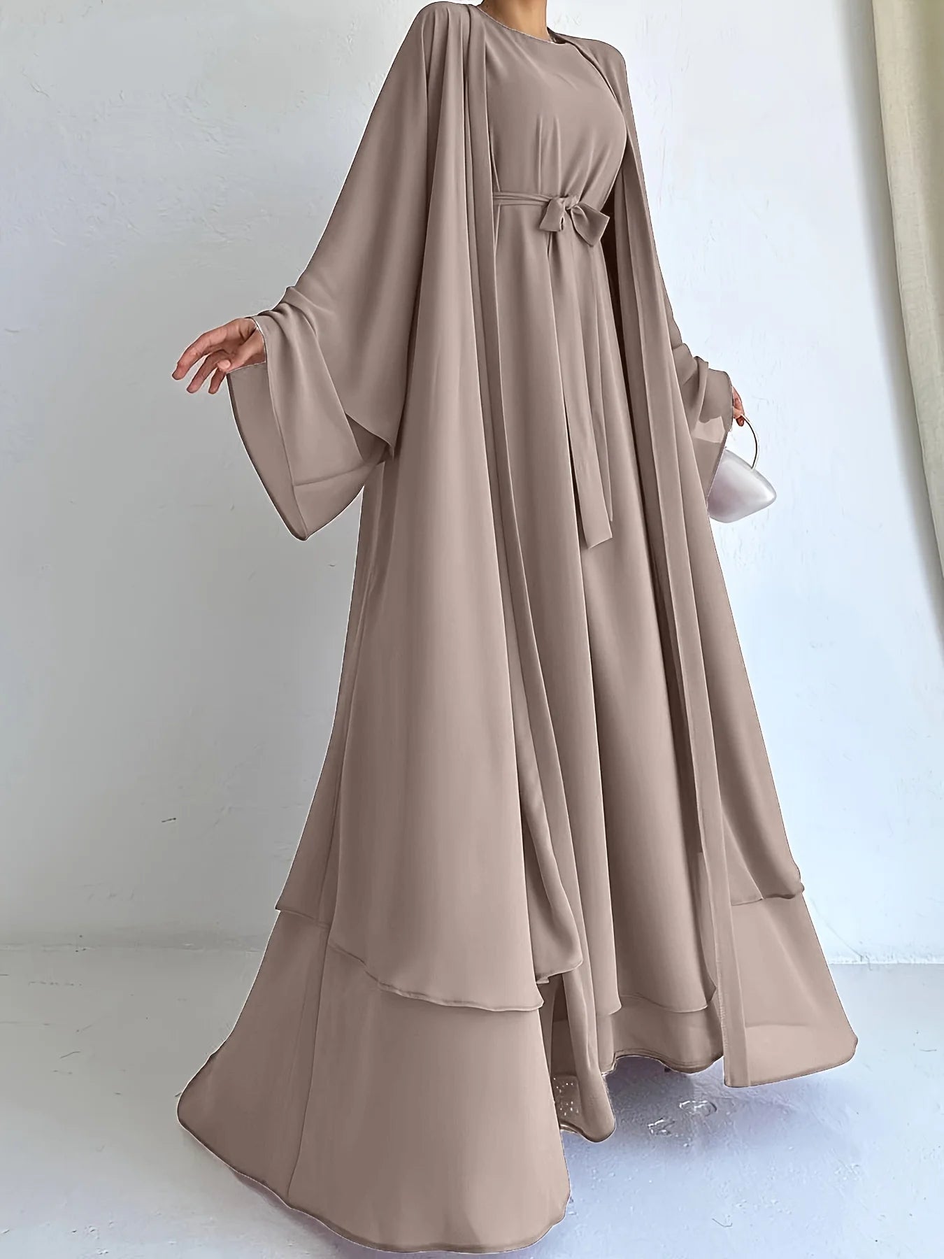 Muslim robe, a two-piece outfit consisting of a vest and a wrap dress, includes a belt.