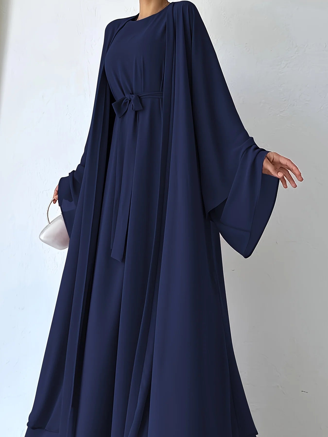 Muslim robe, a two-piece outfit consisting of a vest and a wrap dress, includes a belt.