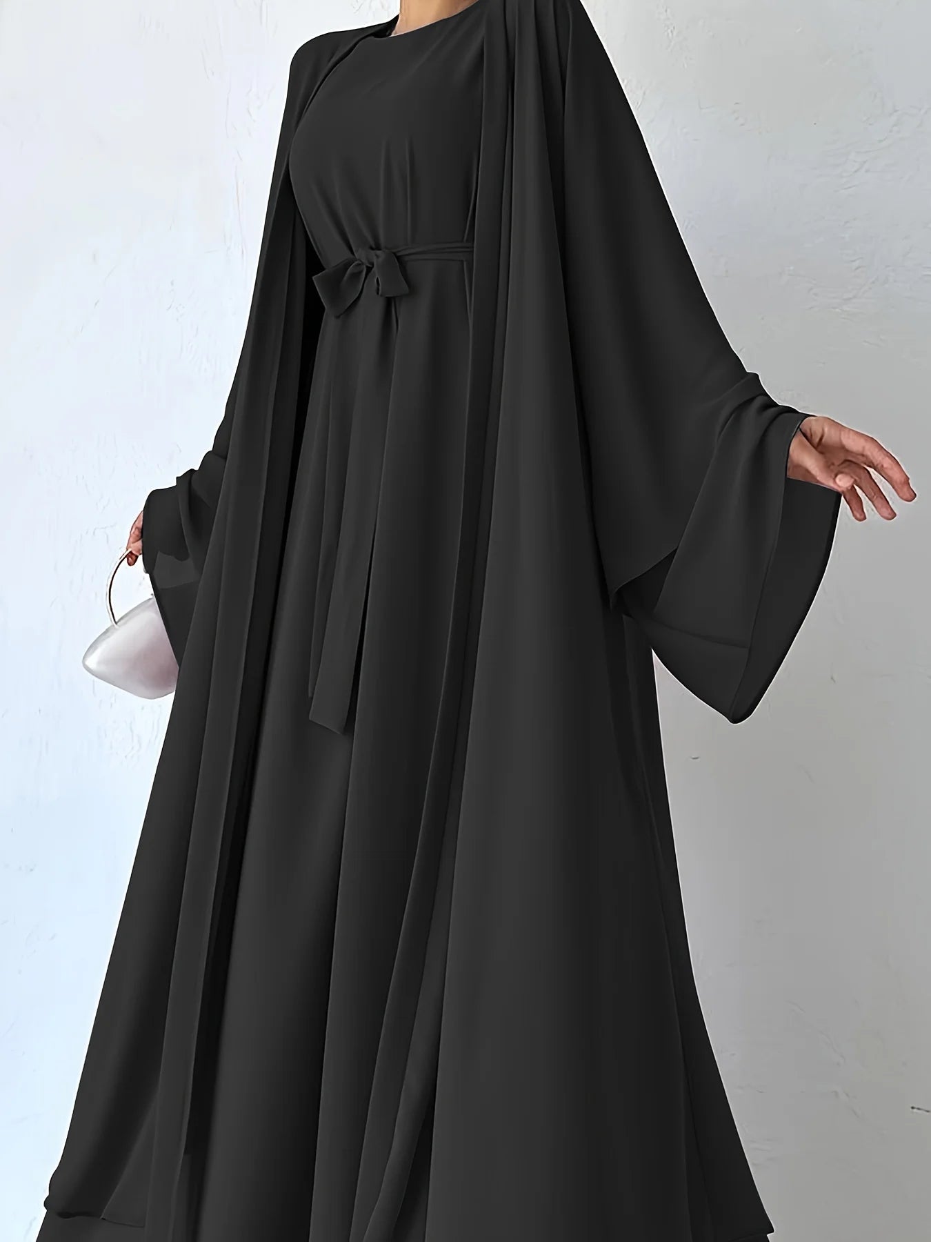 Muslim robe, a two-piece outfit consisting of a vest and a wrap dress, includes a belt.