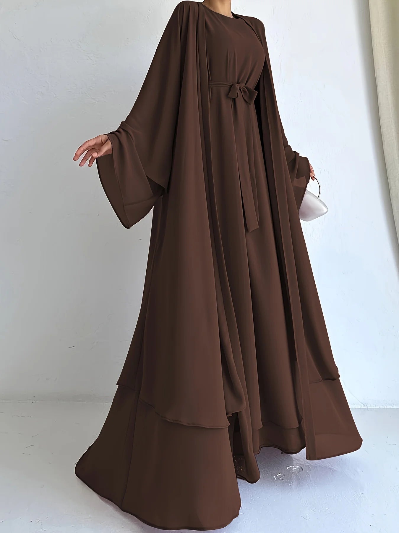 Muslim robe, a two-piece outfit consisting of a vest and a wrap dress, includes a belt.