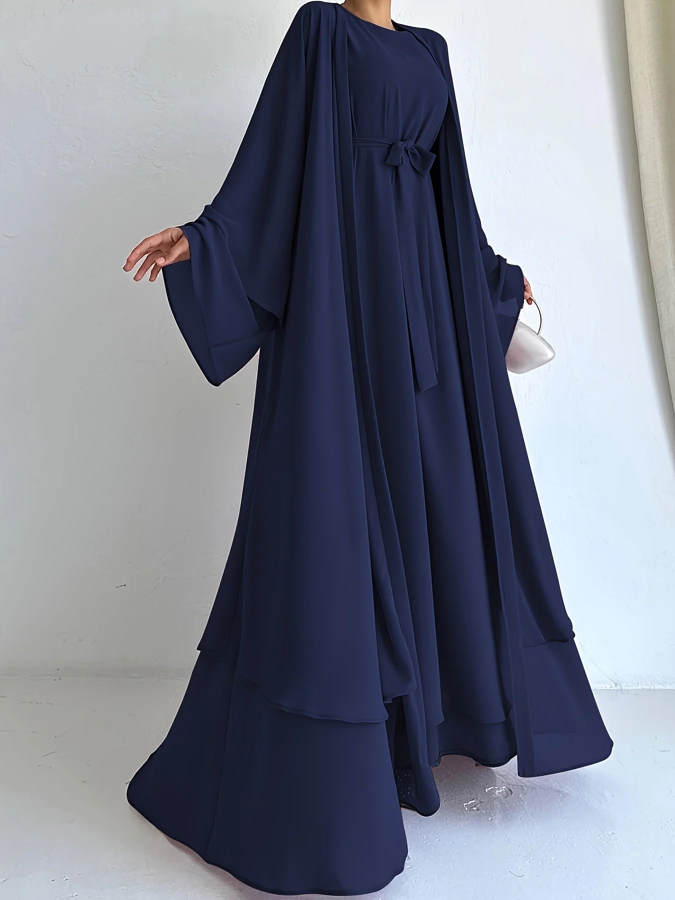 Muslim robe, a two-piece outfit consisting of a vest and a wrap dress, includes a belt.