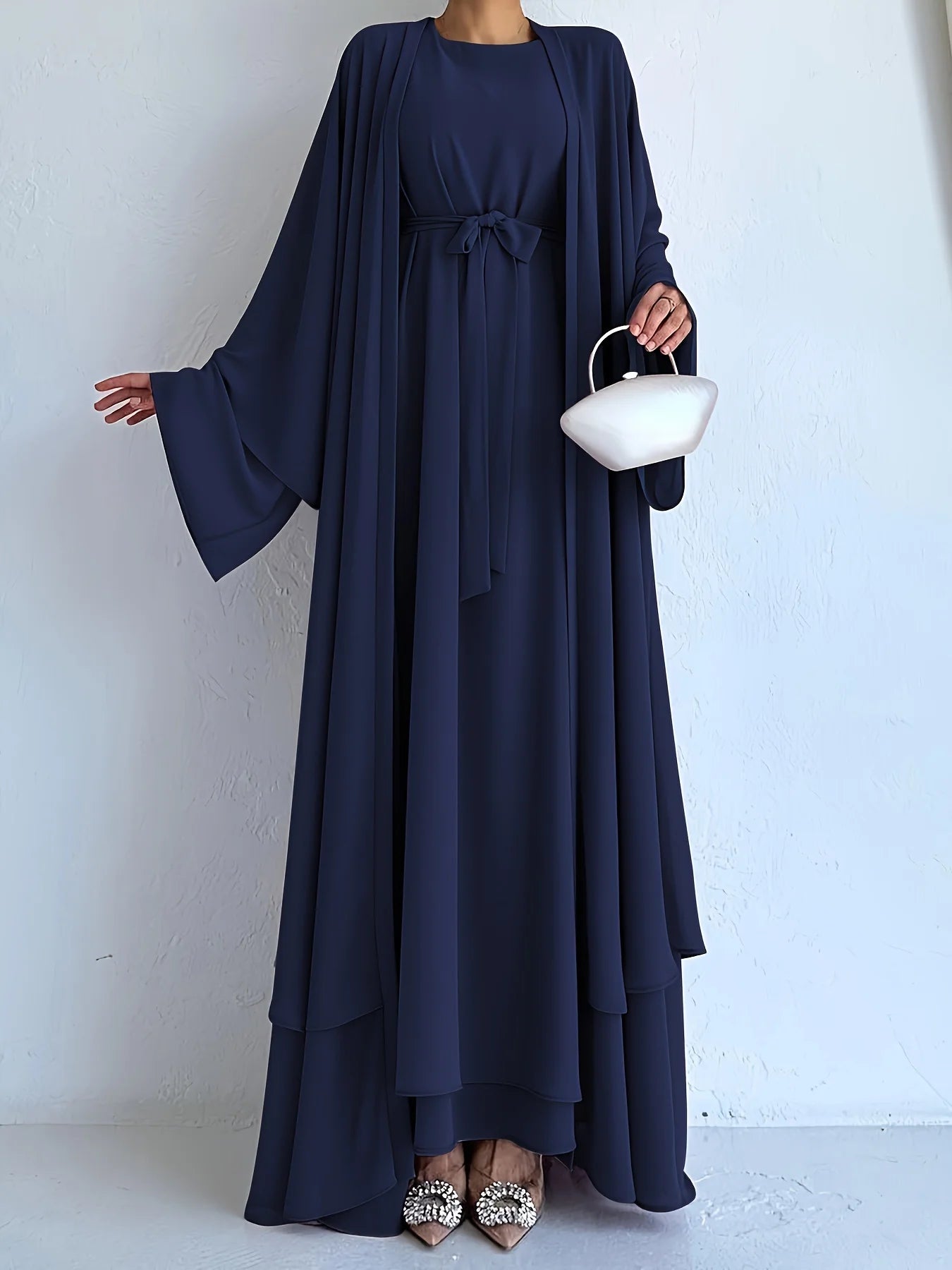 Muslim robe, a two-piece outfit consisting of a vest and a wrap dress, includes a belt.