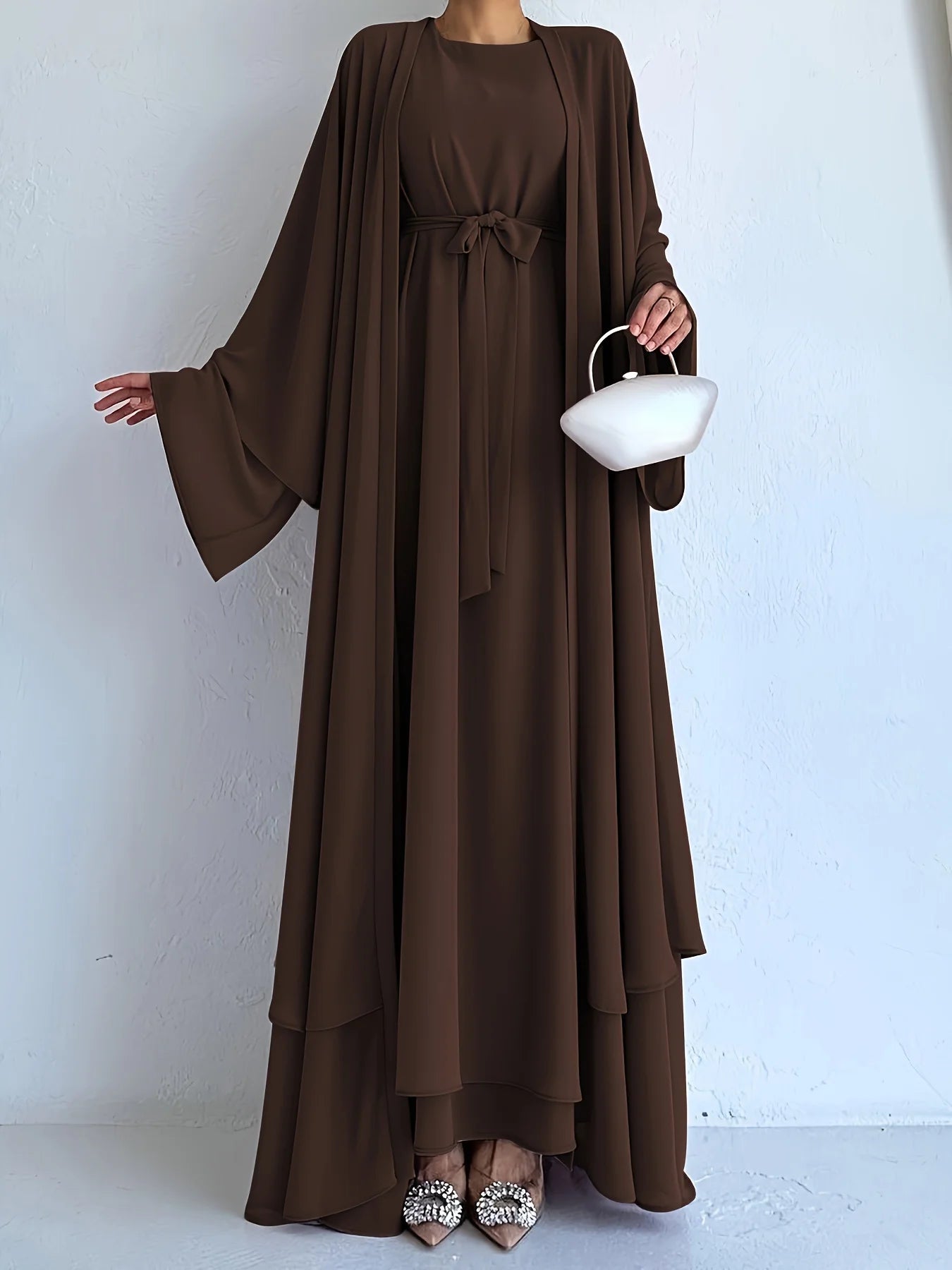 Muslim robe, a two-piece outfit consisting of a vest and a wrap dress, includes a belt.