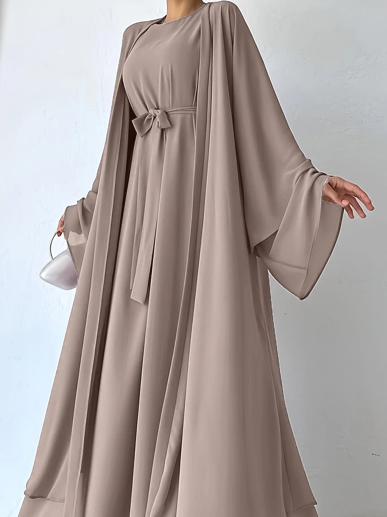 Muslim robe, a two-piece outfit consisting of a vest and a wrap dress, includes a belt.