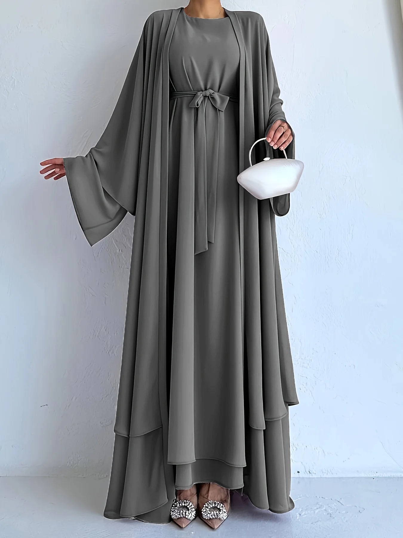 Muslim robe, a two-piece outfit consisting of a vest and a wrap dress, includes a belt.